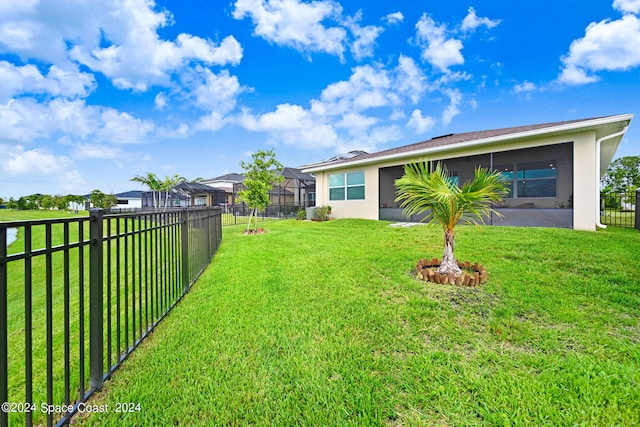 view of yard featuring a lanai