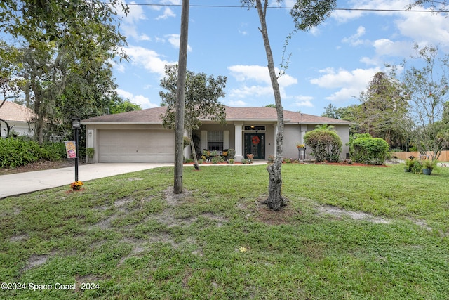 single story home featuring a front yard and a garage