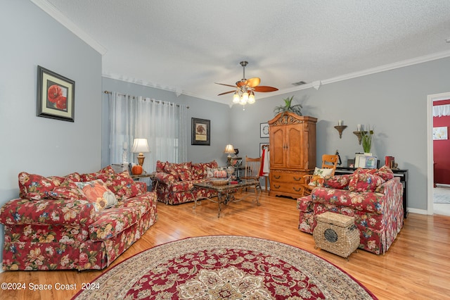 living room with light hardwood / wood-style floors, ceiling fan, and plenty of natural light