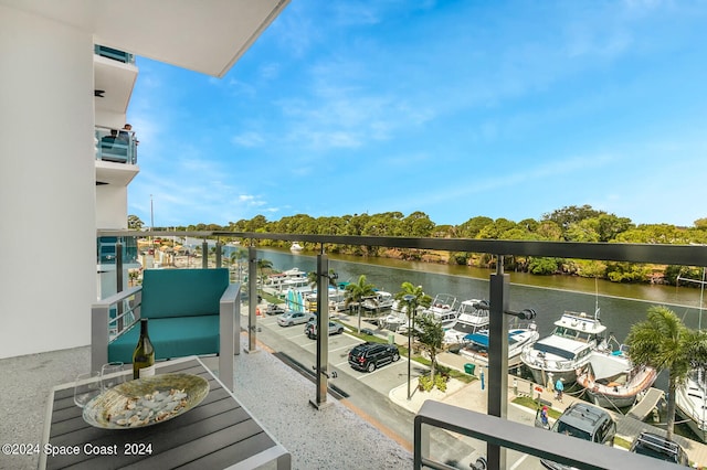 balcony featuring a water view