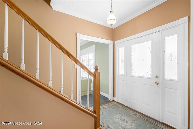 entryway with crown molding