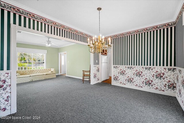 carpeted spare room with ornamental molding and ceiling fan with notable chandelier