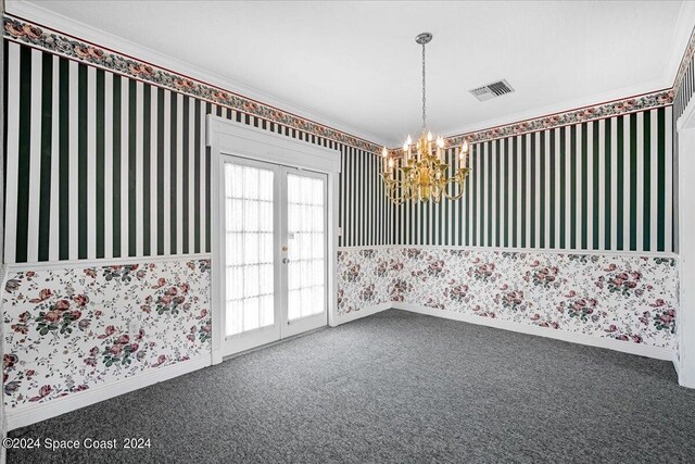 unfurnished room featuring french doors, a wealth of natural light, a notable chandelier, and carpet floors