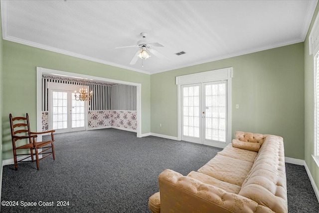 living area with crown molding, dark carpet, ceiling fan with notable chandelier, and french doors