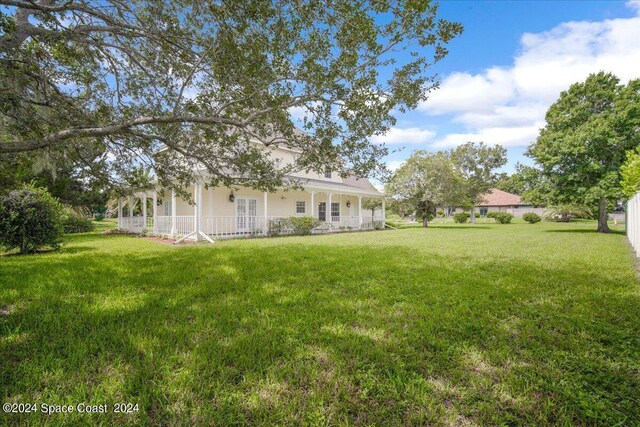 view of yard with covered porch