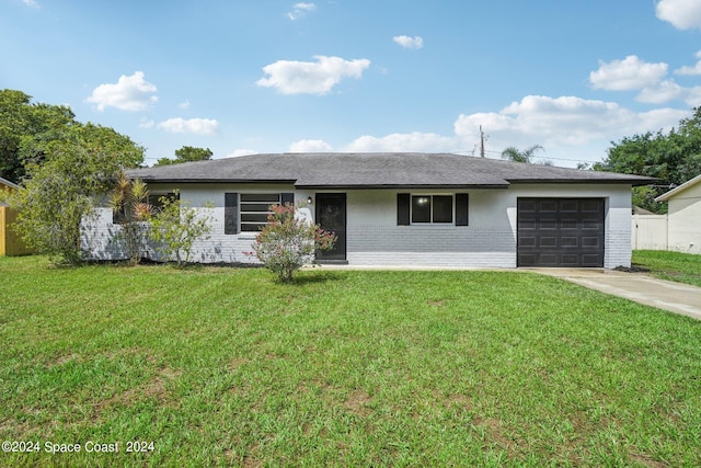 ranch-style home featuring a front yard and a garage