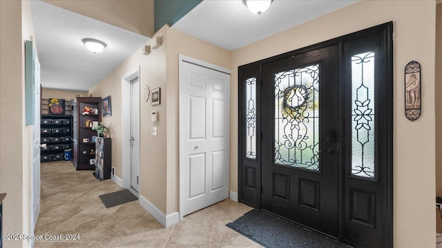 entrance foyer featuring a textured ceiling