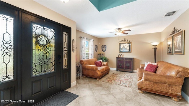 entrance foyer with ceiling fan