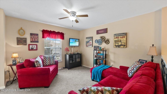 living room with carpet flooring, ceiling fan, and a textured ceiling