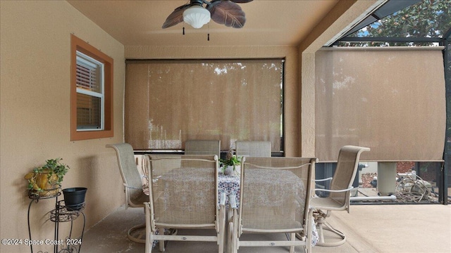 sunroom featuring ceiling fan