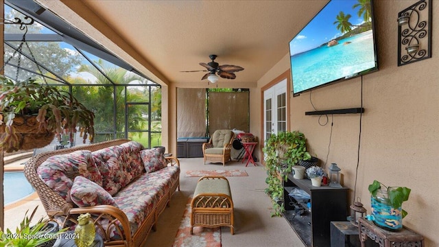 sunroom / solarium featuring a wealth of natural light and ceiling fan