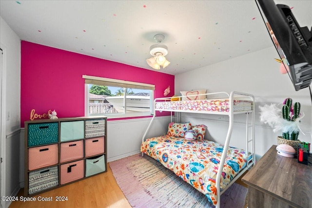 bedroom with ceiling fan and light hardwood / wood-style floors