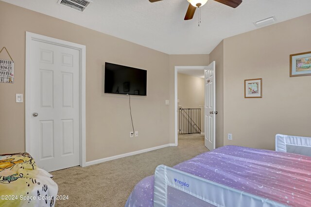 carpeted bedroom with ceiling fan