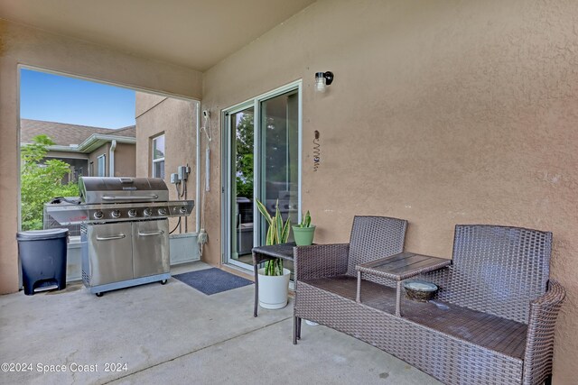 view of patio featuring a grill