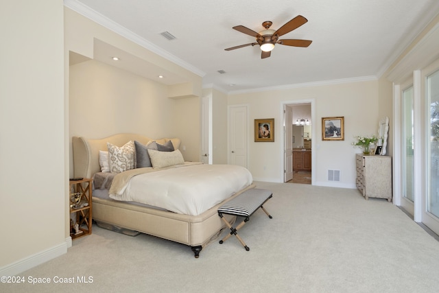 bedroom with ensuite bathroom, light colored carpet, ceiling fan, and crown molding