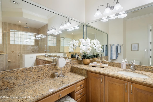 bathroom featuring walk in shower, vanity, and crown molding