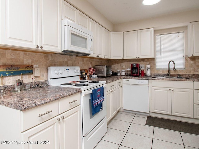 kitchen featuring white cabinets, white appliances, and sink