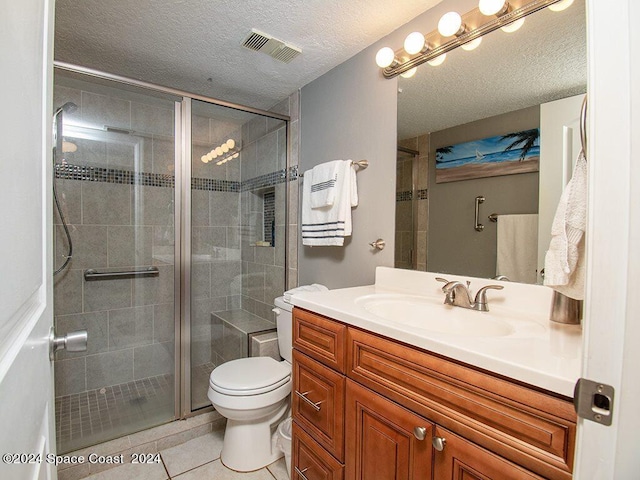 bathroom with toilet, an enclosed shower, tile patterned flooring, vanity, and a textured ceiling