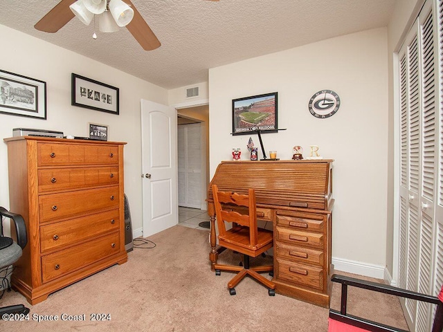 office with light carpet, a textured ceiling, and ceiling fan