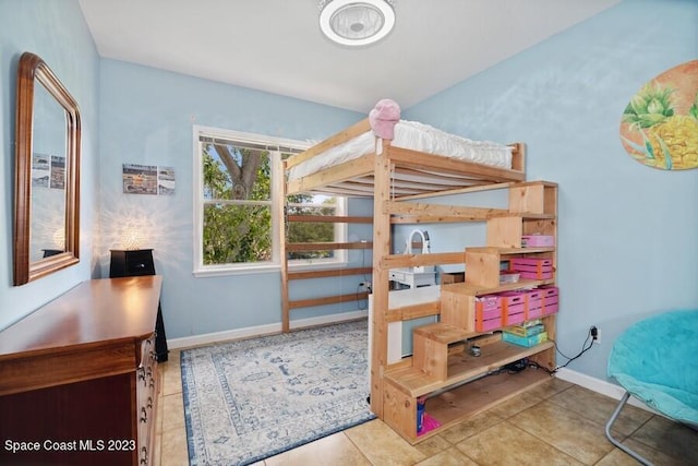 tiled bedroom with baseboards