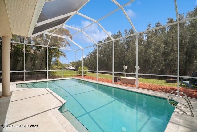 view of pool featuring a patio and a lanai