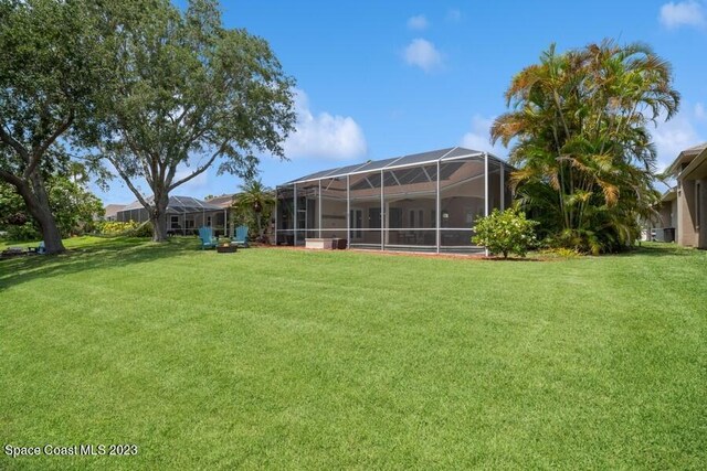 view of yard with a lanai