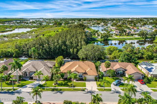 drone / aerial view with a water view