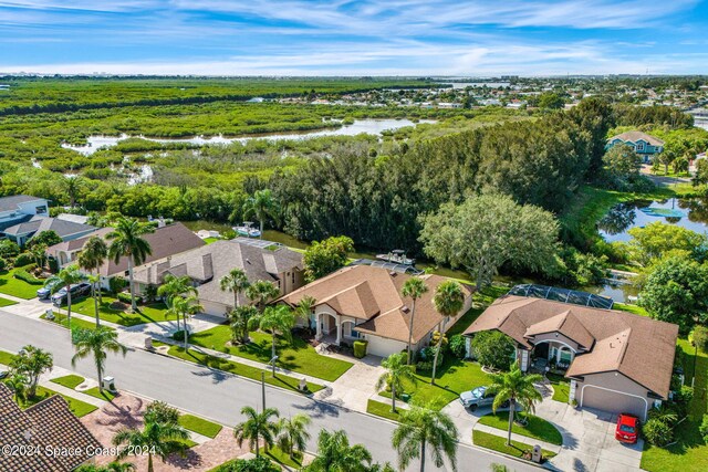 birds eye view of property with a water view