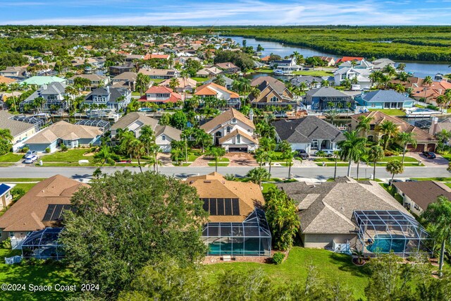 aerial view featuring a residential view and a water view