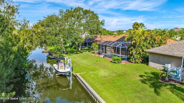 exterior space featuring a water view, a yard, and a lanai