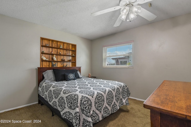 carpeted bedroom with a textured ceiling and ceiling fan