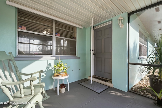 entrance to property featuring a porch