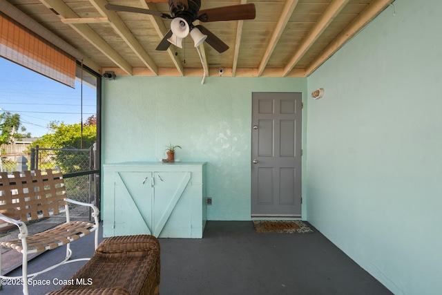 doorway to property with ceiling fan