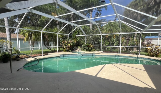 view of pool featuring a lanai and a patio area