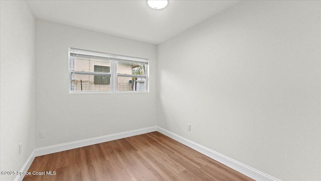 empty room featuring hardwood / wood-style floors