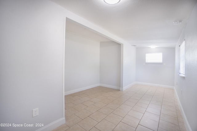 empty room featuring light tile patterned flooring