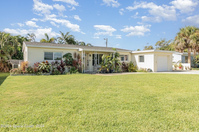 ranch-style home featuring a garage and a front lawn