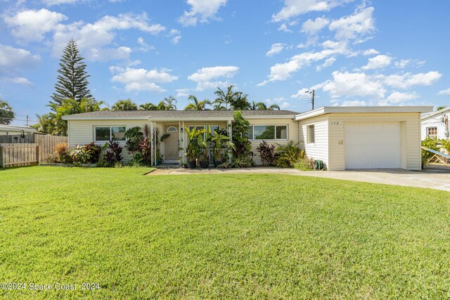 single story home with a garage and a front yard