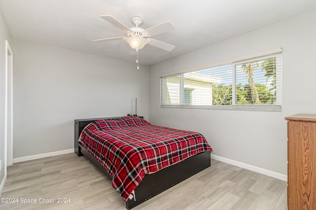 bedroom featuring light hardwood / wood-style flooring and ceiling fan