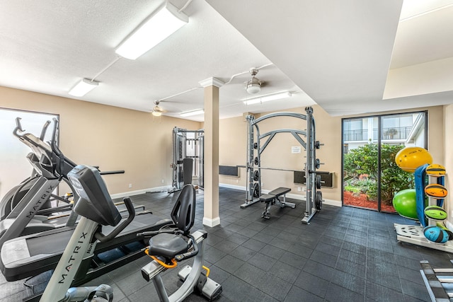 exercise room with a textured ceiling