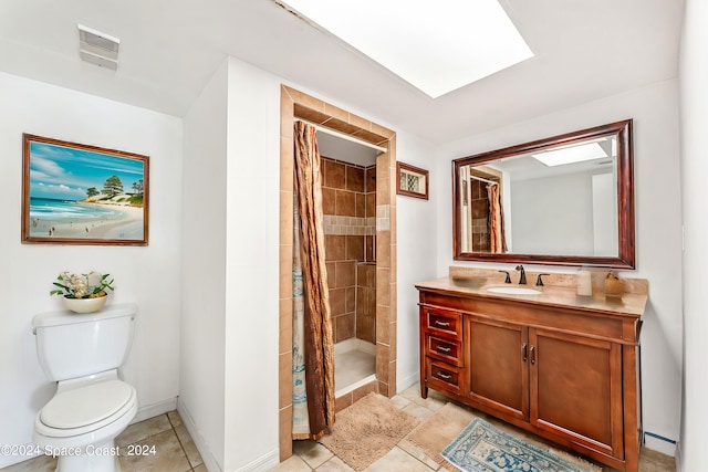 bathroom with tile patterned flooring, vanity, toilet, and a shower with shower curtain