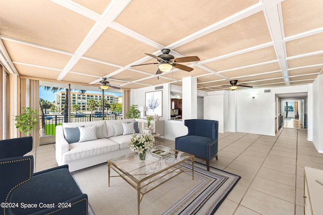 sunroom / solarium with ceiling fan and coffered ceiling