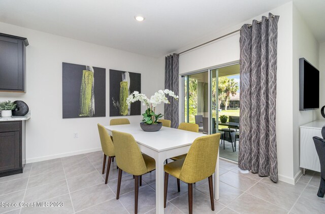 dining area with light tile patterned floors