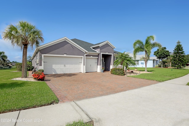 ranch-style house with a front lawn and a garage