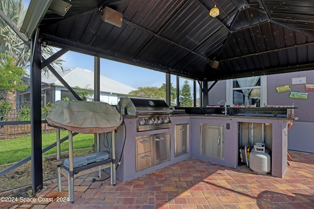 view of patio / terrace featuring a gazebo, a grill, area for grilling, and sink