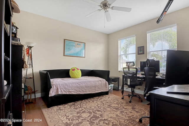 bedroom featuring hardwood / wood-style floors and ceiling fan