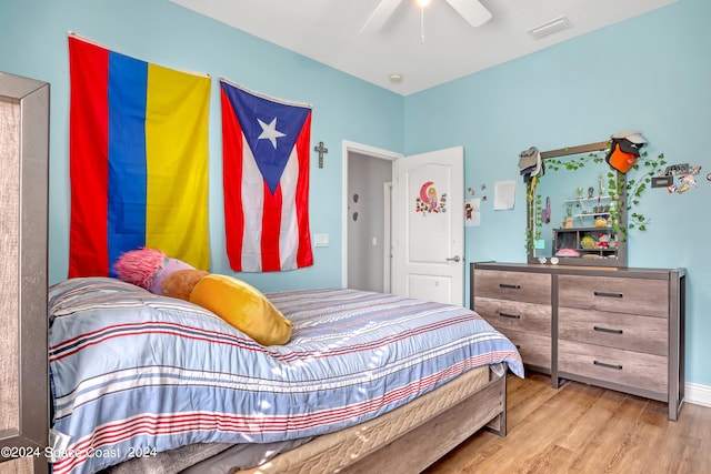 bedroom featuring ceiling fan and hardwood / wood-style flooring