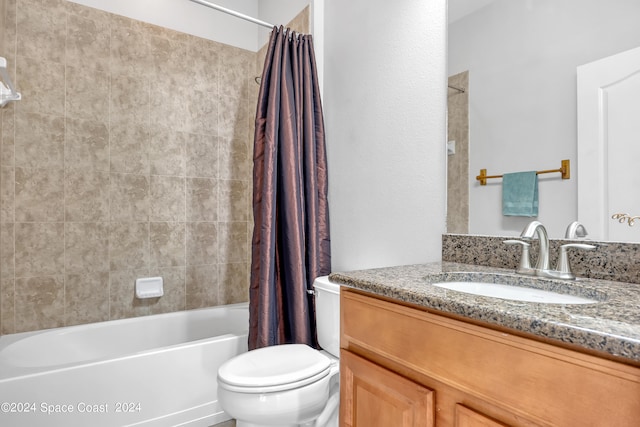 full bathroom featuring shower / bath combination with curtain, vanity, and toilet