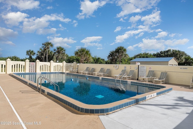 view of pool featuring a patio