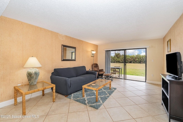 living room with light tile patterned floors and a textured ceiling